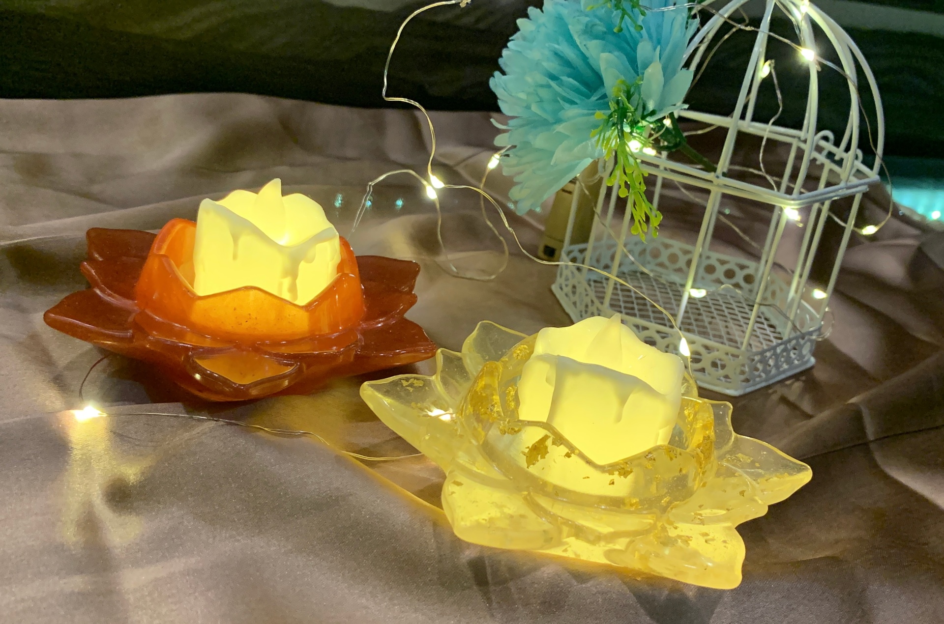 Handmade resin lotus candle holders in amber and clear with fairy lights