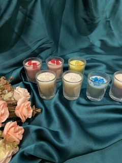 Collection of seven hand-poured candles in pastel shades