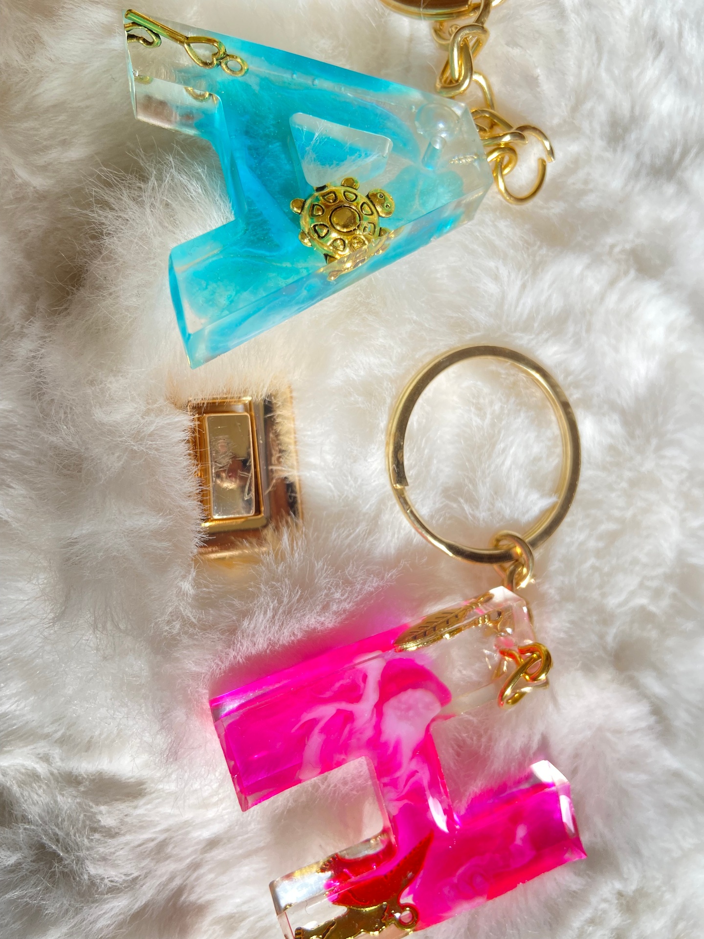 Turquoise B and hot pink E resin initial keychains